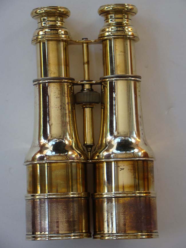 A pair of all brass field glasses by Colmont of Paris circa 1875 and inscribed "Day or Night"
